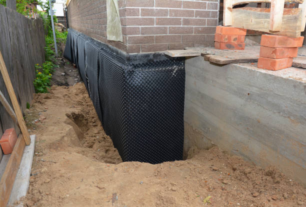 Happy homeowners after waterproofing job in Syracuse
